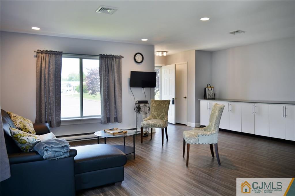 526 B Belford Road Monroe Township, NJ 08831 - Photo 2 of 13 a living room with furniture and a large window