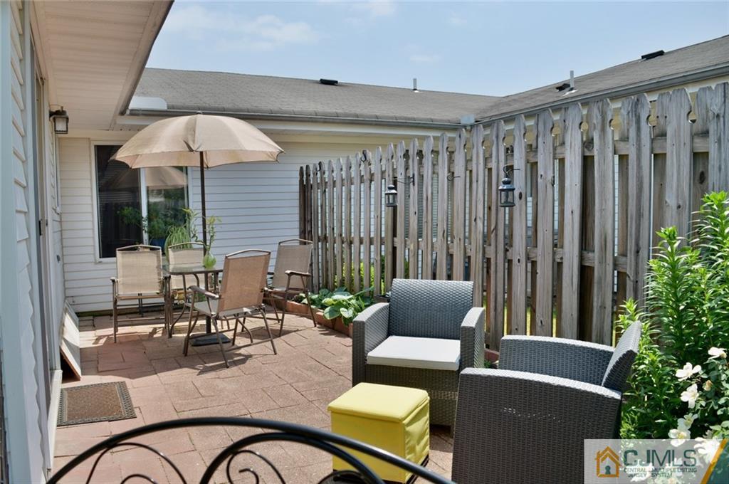 526 B Belford Road Monroe Township, NJ 08831 - Photo 13 of 13 a building outdoor space with patio furniture