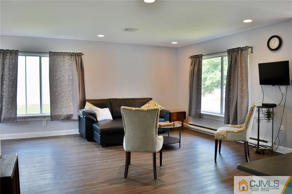 526 B Belford Road Monroe Township, NJ 08831 - Photo 4 of 13 a living room with furniture a flat screen tv and a window