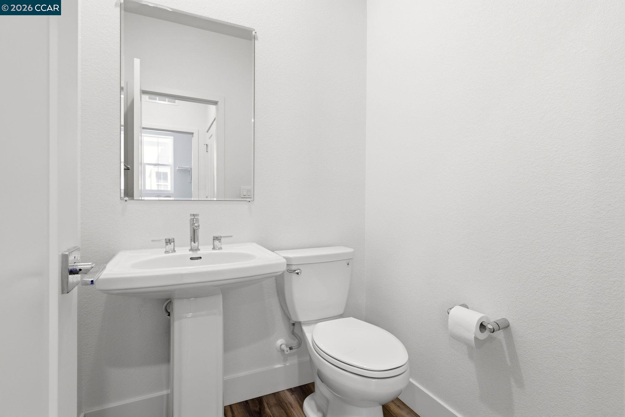 205 Plum Tree Street Livermore, CA 94551 - Photo 12 of 47 a bathroom with a toilet a sink and mirror