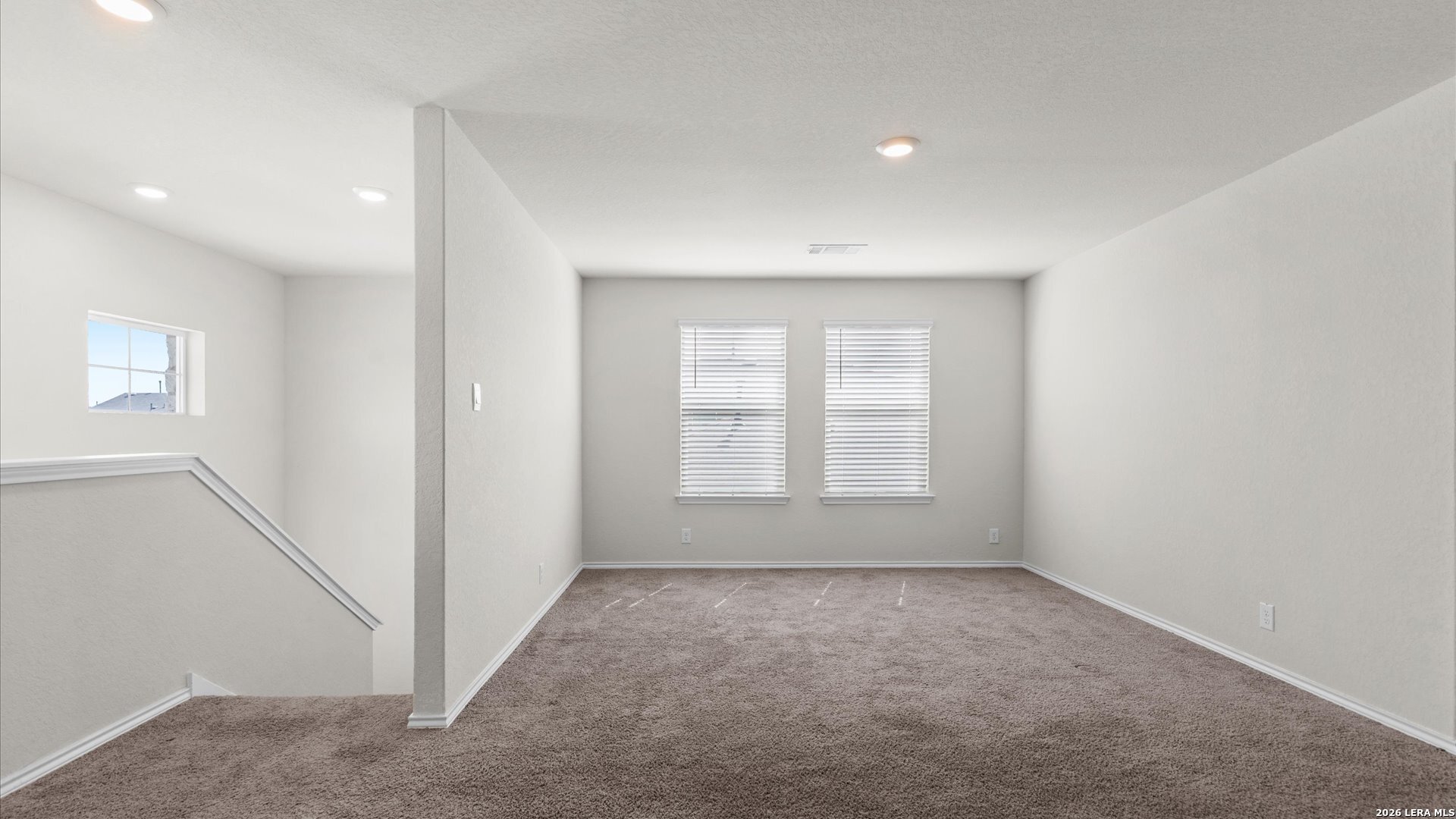 6819 Rondo Measure San Antonio, TX 78252 - Photo 11 of 25 an empty room with windows