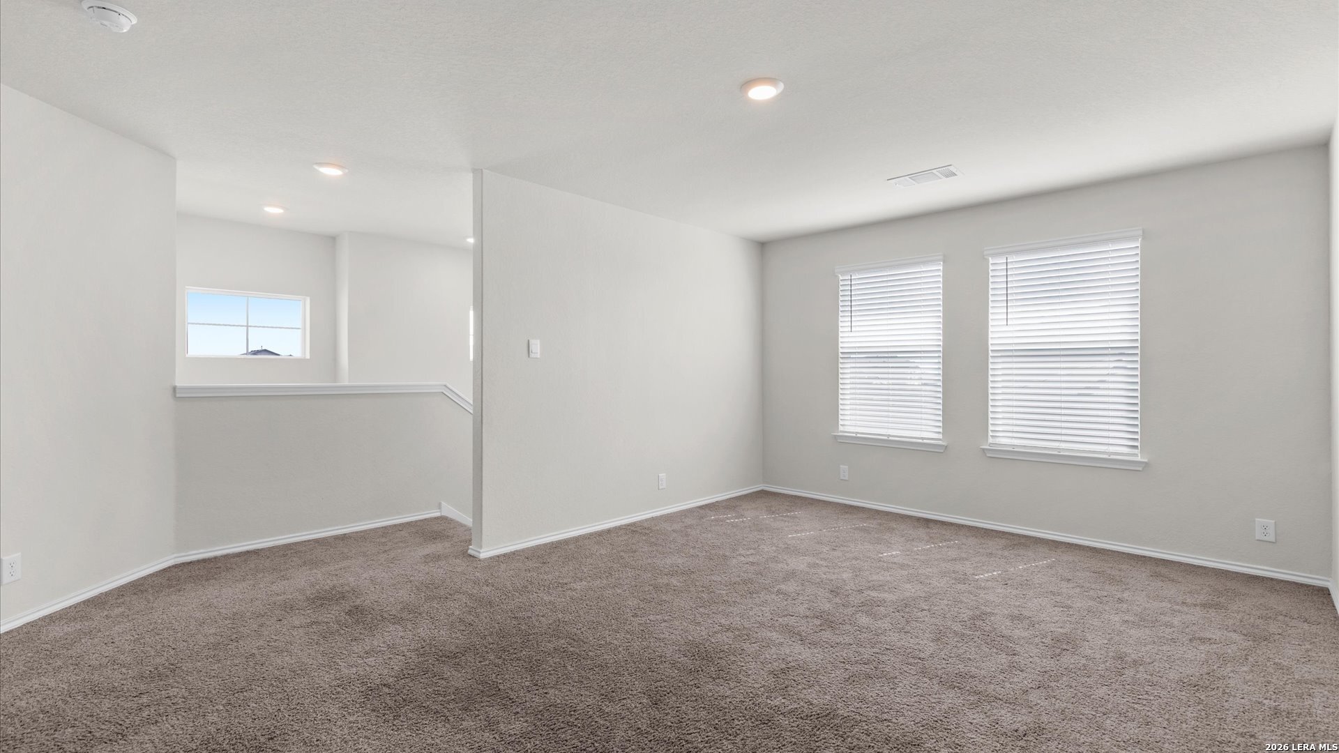 6819 Rondo Measure San Antonio, TX 78252 - Photo 12 of 25 an empty room with windows