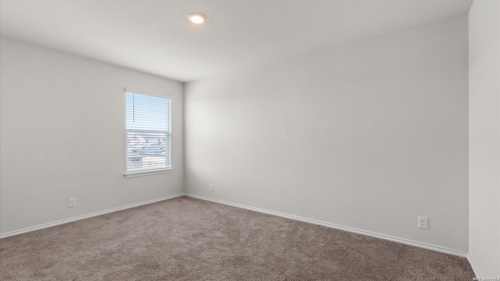 6819 Rondo Measure San Antonio, TX 78252 - Photo 13 of 25 an empty room with windows