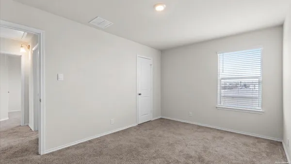 a view of a room that has a window in it