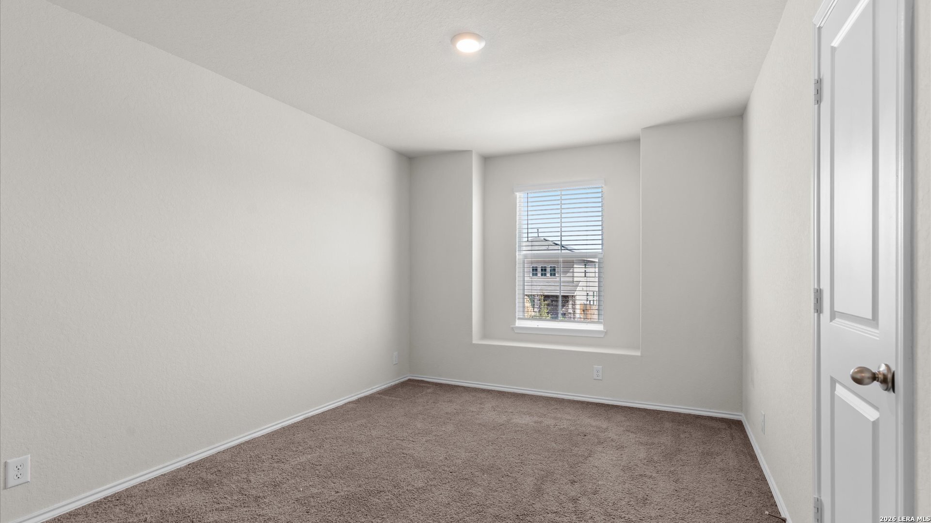 6819 Rondo Measure San Antonio, TX 78252 - Photo 18 of 25 an empty room with a window