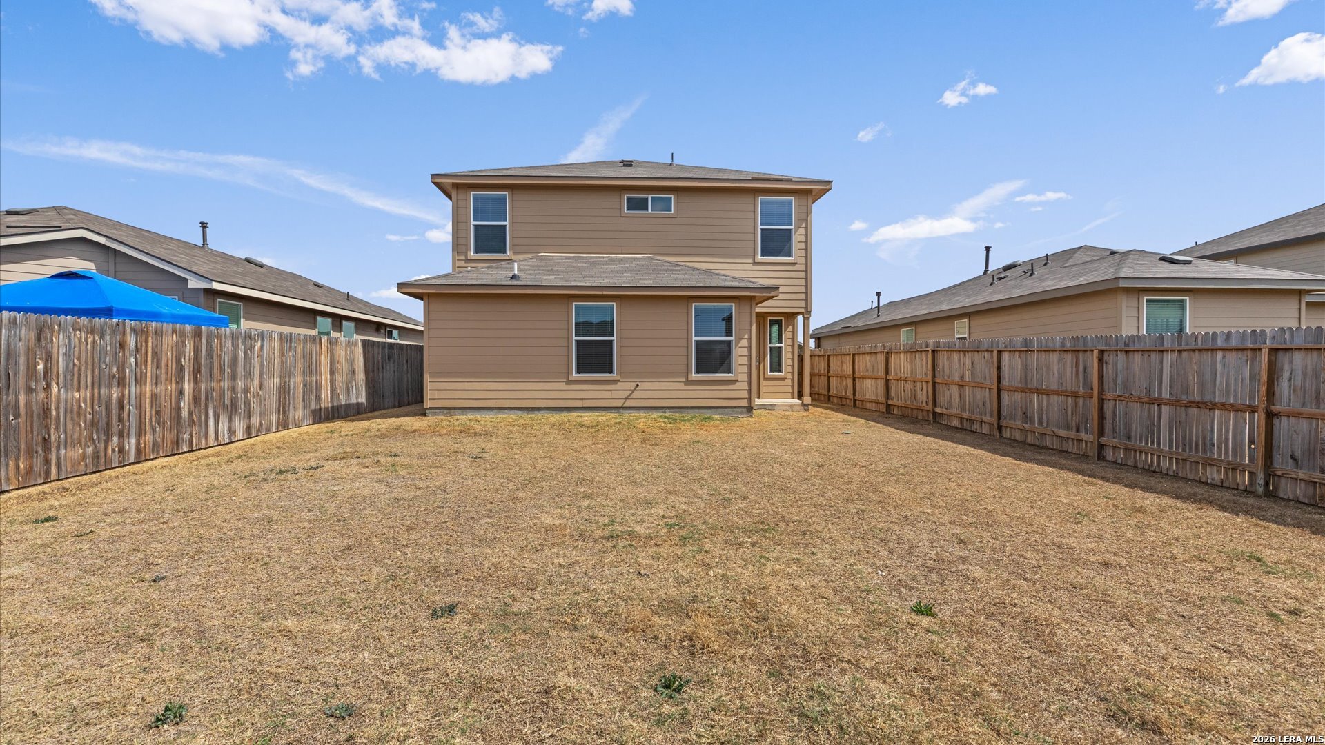6819 Rondo Measure San Antonio, TX 78252 - Photo 21 of 25 a view of a house with a wooden fence