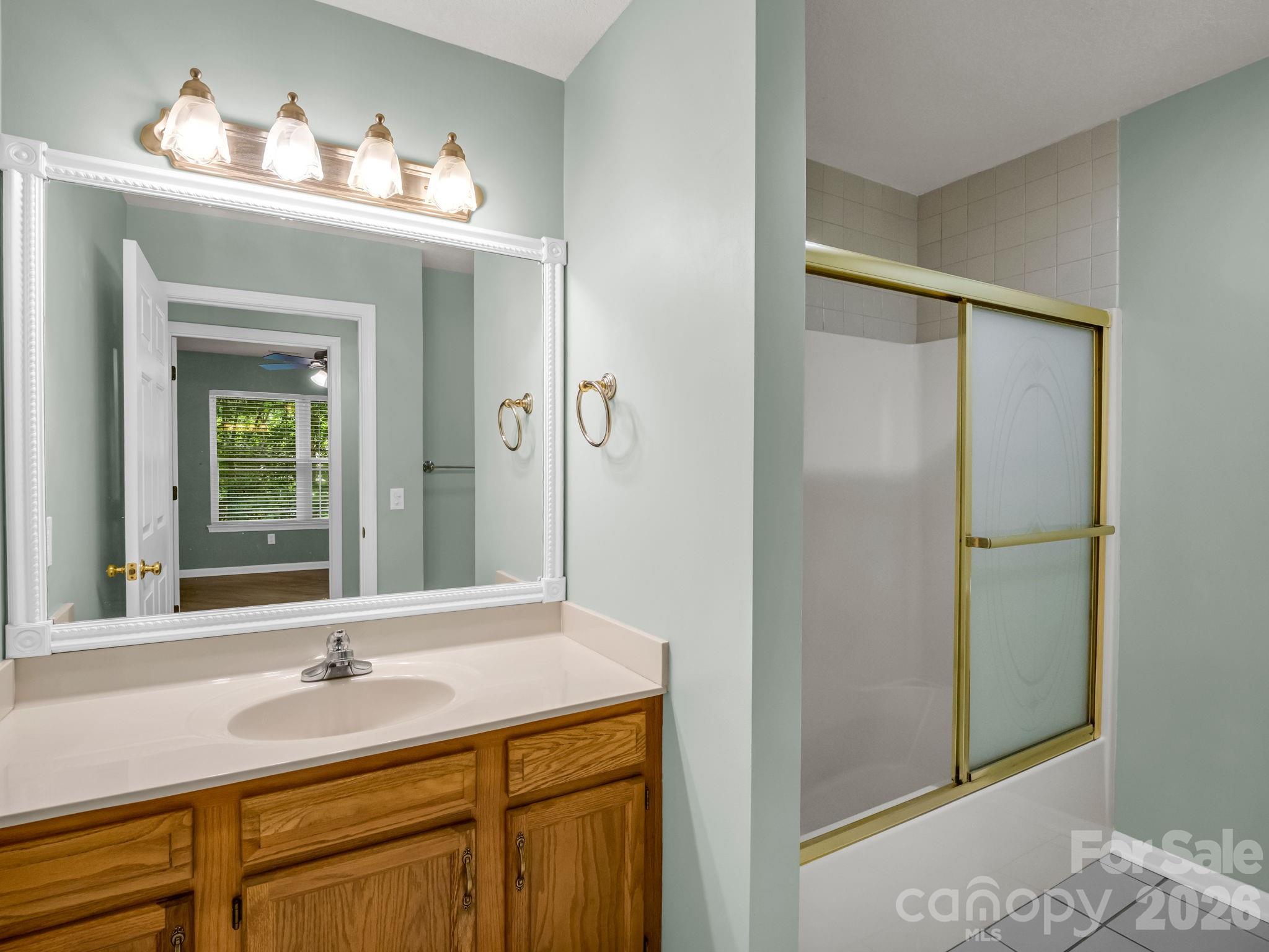 4 Rathfarnham Road, Unit 4F Asheville, NC 28803 - Photo 22 of 33 a bathroom with a sink and a mirror