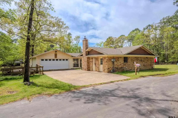 a view of house with outdoor space and street