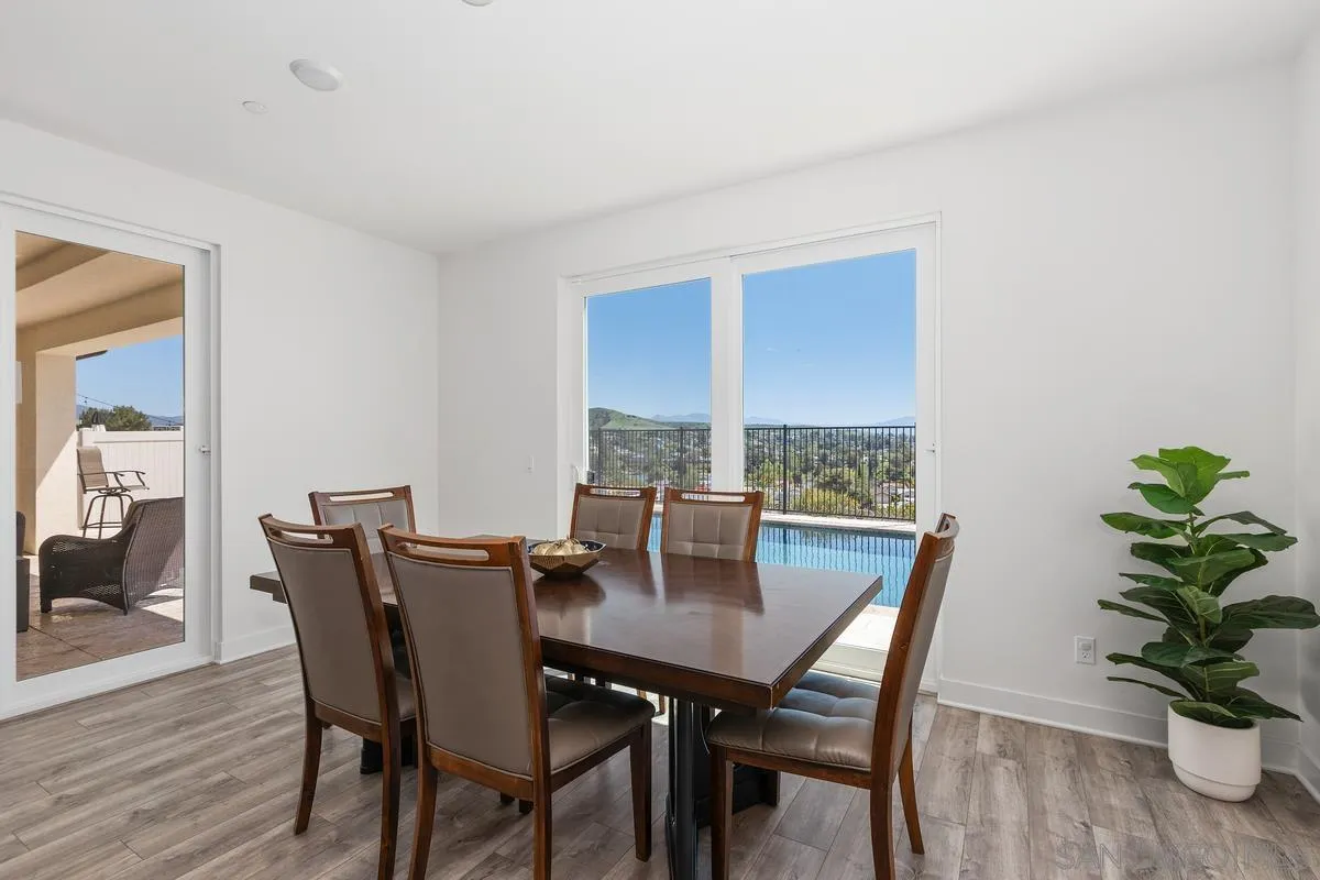 8741 Weston Road Santee, CA 92071 - Photo 12 of 53 a view of a dining room with furniture window and wooden floor
