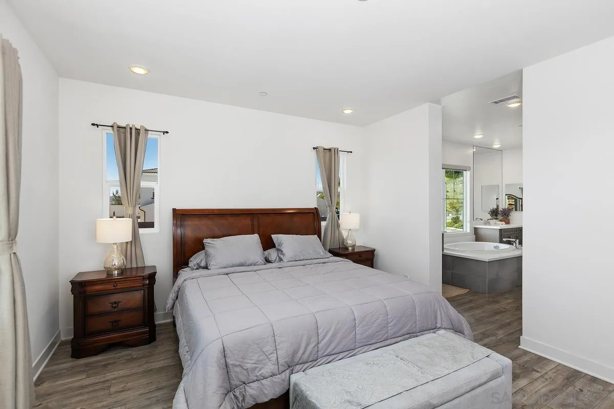 8741 Weston Road Santee, CA 92071 - Photo 15 of 53 a bedroom with a bed and a view of kitchen