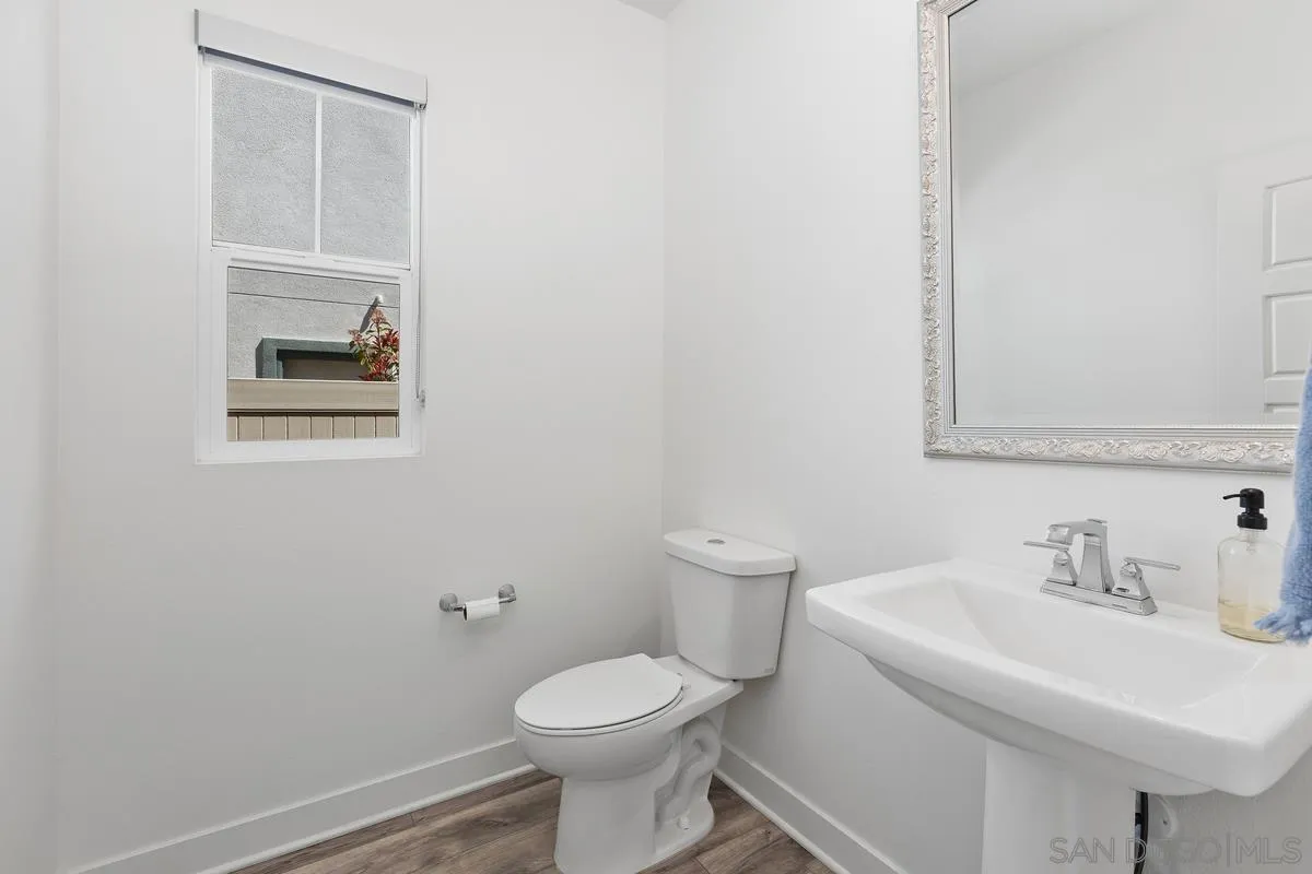 8741 Weston Road Santee, CA 92071 - Photo 19 of 53 a bathroom with a sink toilet and vanity