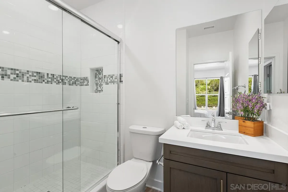 8741 Weston Road Santee, CA 92071 - Photo 21 of 53 a bathroom with a sink a toilet and shower