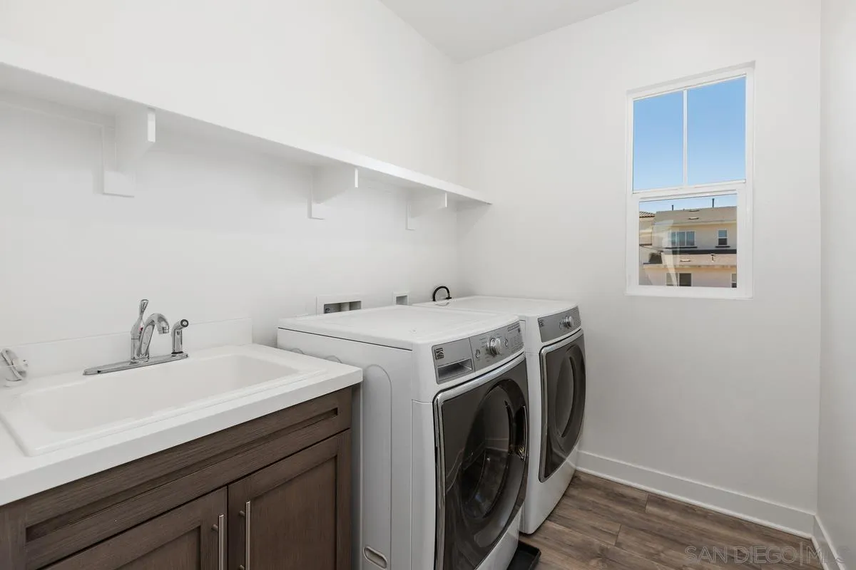 8741 Weston Road Santee, CA 92071 - Photo 23 of 53 a utility room with sink dryer and washer