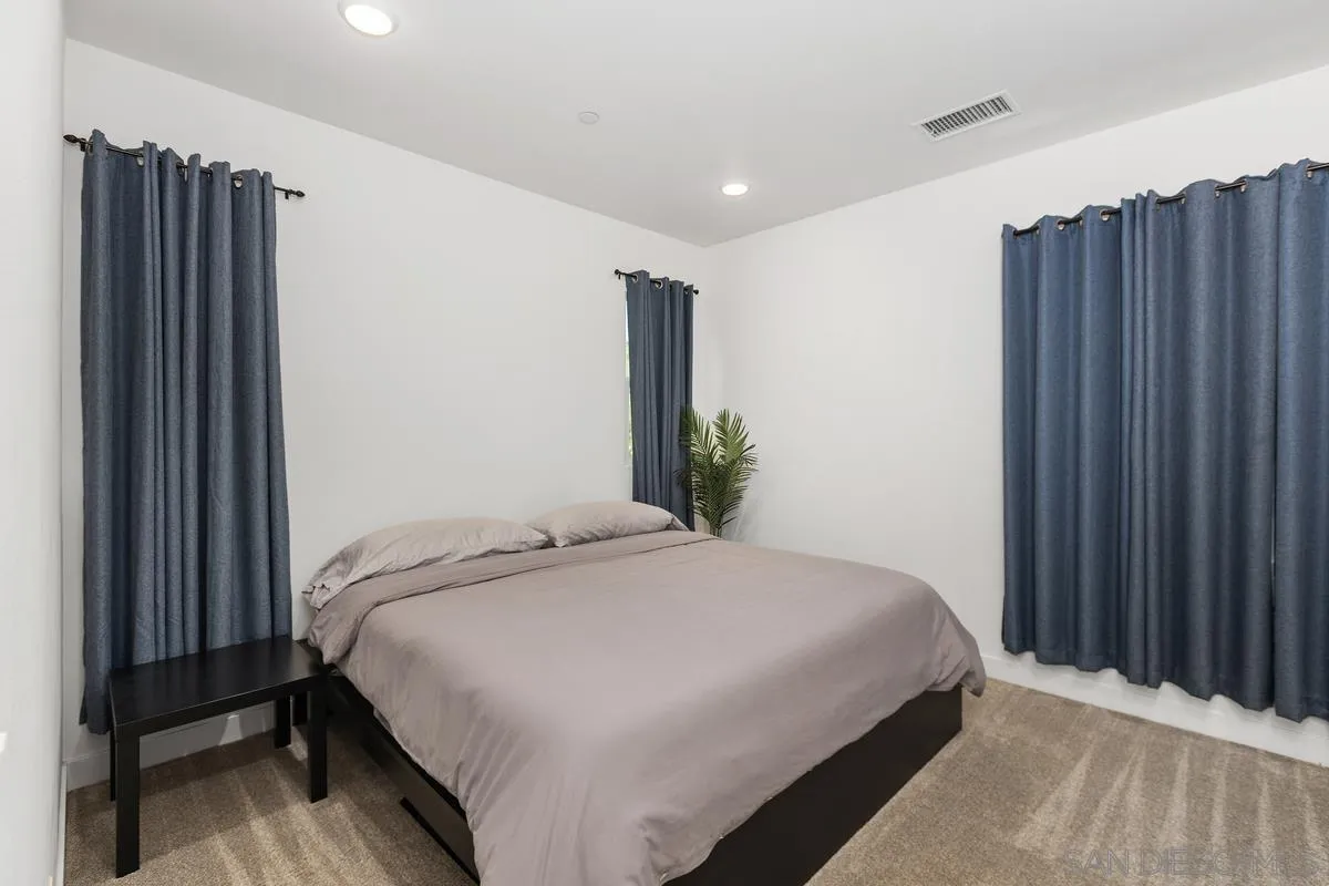 8741 Weston Road Santee, CA 92071 - Photo 29 of 53 a bedroom with a bed and a dresser
