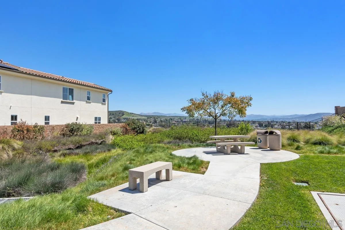 8741 Weston Road Santee, CA 92071 - Photo 36 of 53 a view of a patio with a table and chairs