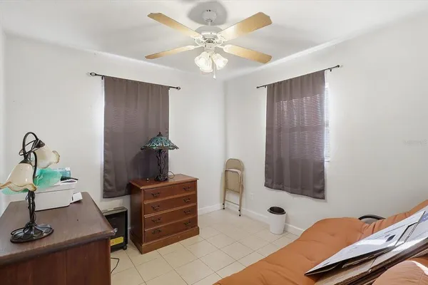 a view of a workspace with furniture and a bathroom