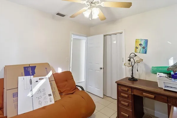 a bed room with a bed and a chandelier