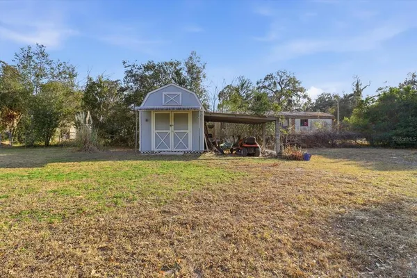 a backyard of a house with lots of green space