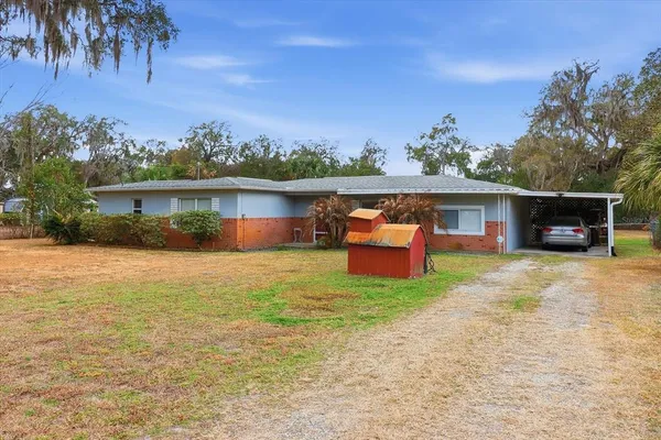 front view of a house with a big yard