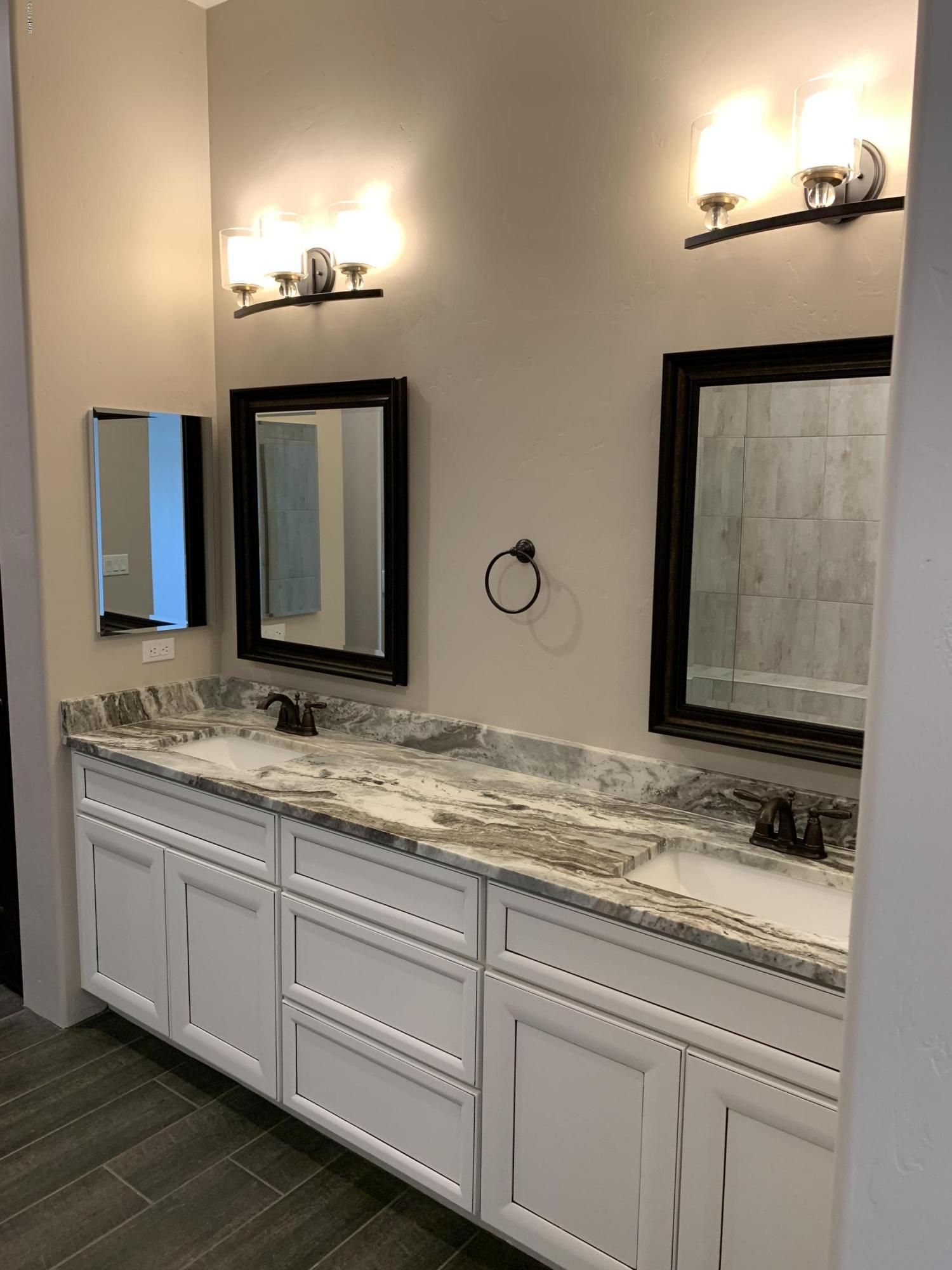 4731 North Juneberry Road Lake Havasu City, AZ 86404 - Photo 24 of 52 a bathroom with a sink and a mirror