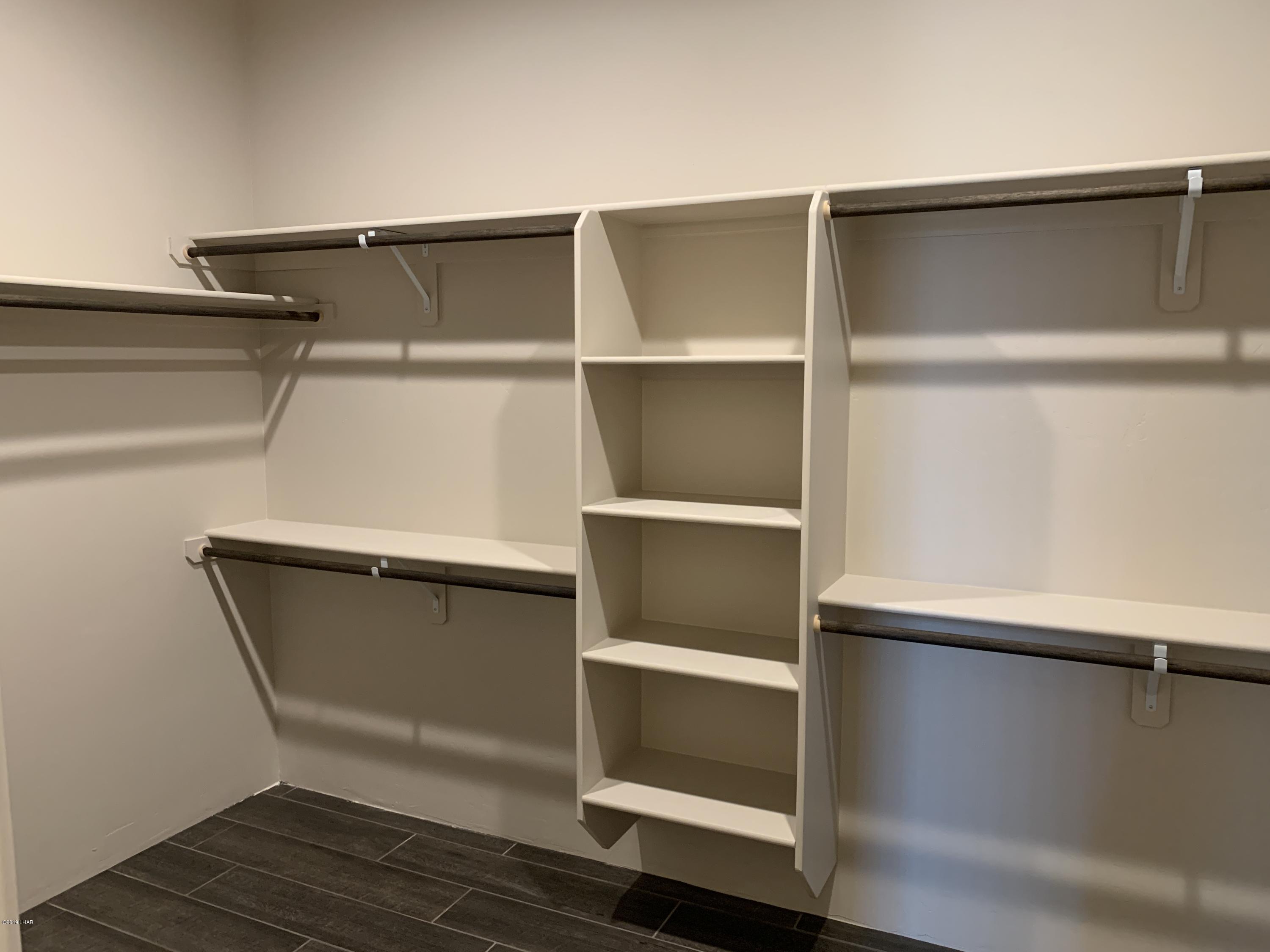 4731 North Juneberry Road Lake Havasu City, AZ 86404 - Photo 27 of 52 a view of walk in closet with empty racks
