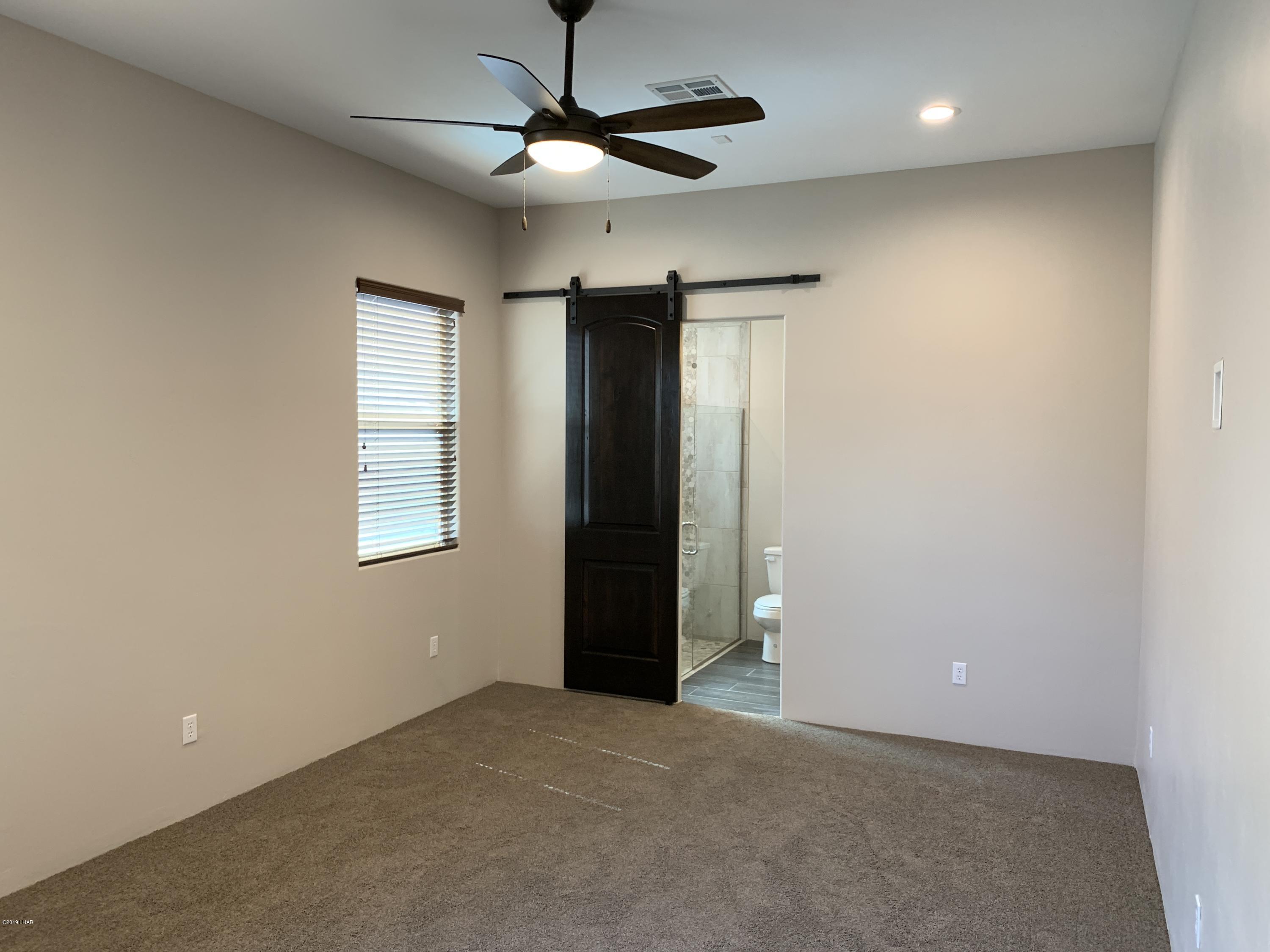4731 North Juneberry Road Lake Havasu City, AZ 86404 - Photo 29 of 52 a view of an empty room with a window