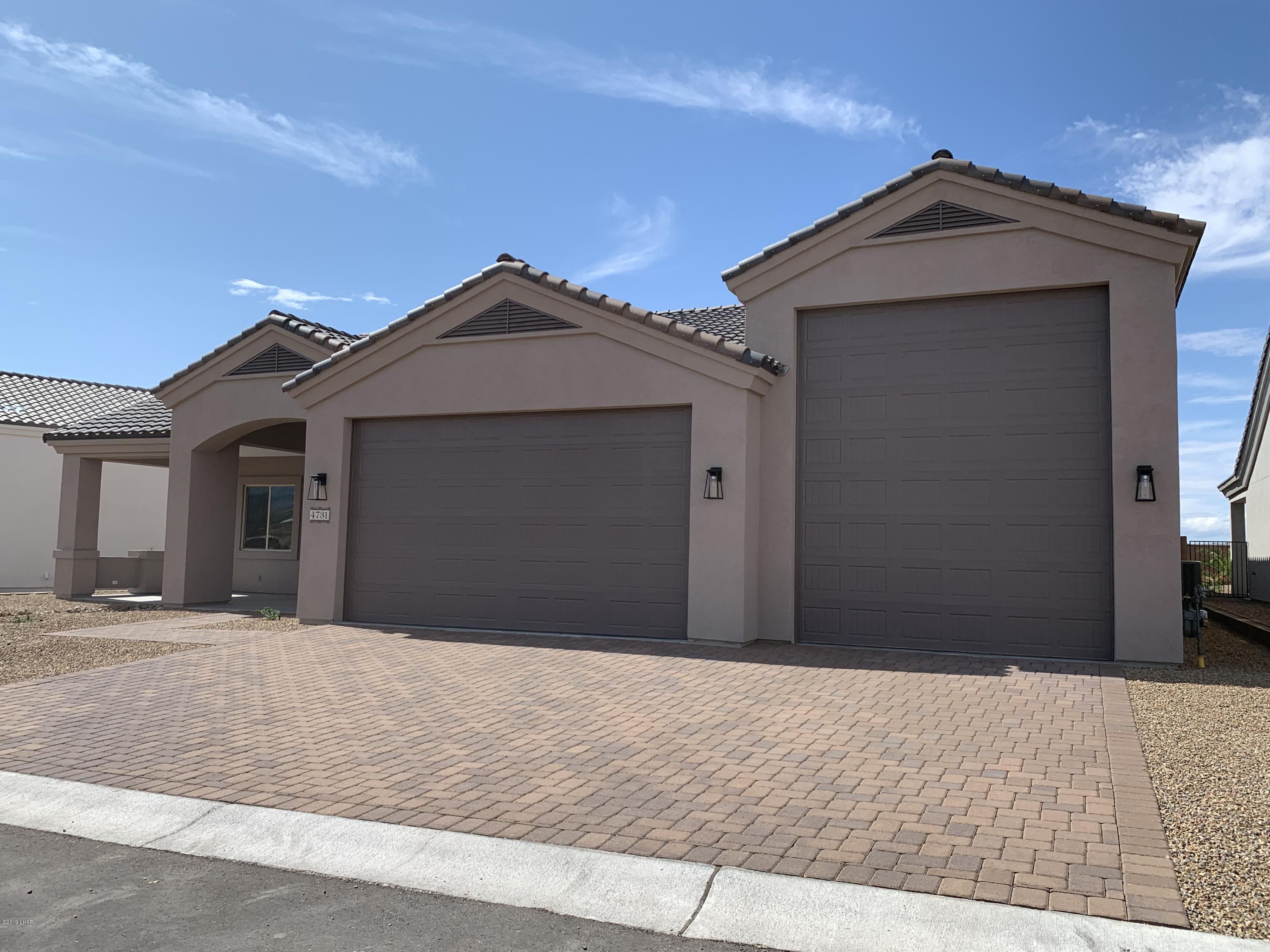 4731 North Juneberry Road Lake Havasu City, AZ 86404 - Photo 3 of 52 a front view of a house with a yard