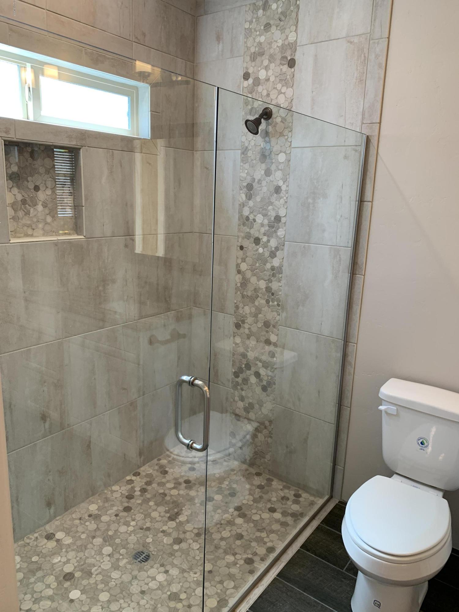 4731 North Juneberry Road Lake Havasu City, AZ 86404 - Photo 33 of 52 a bathroom with a shower and toilet
