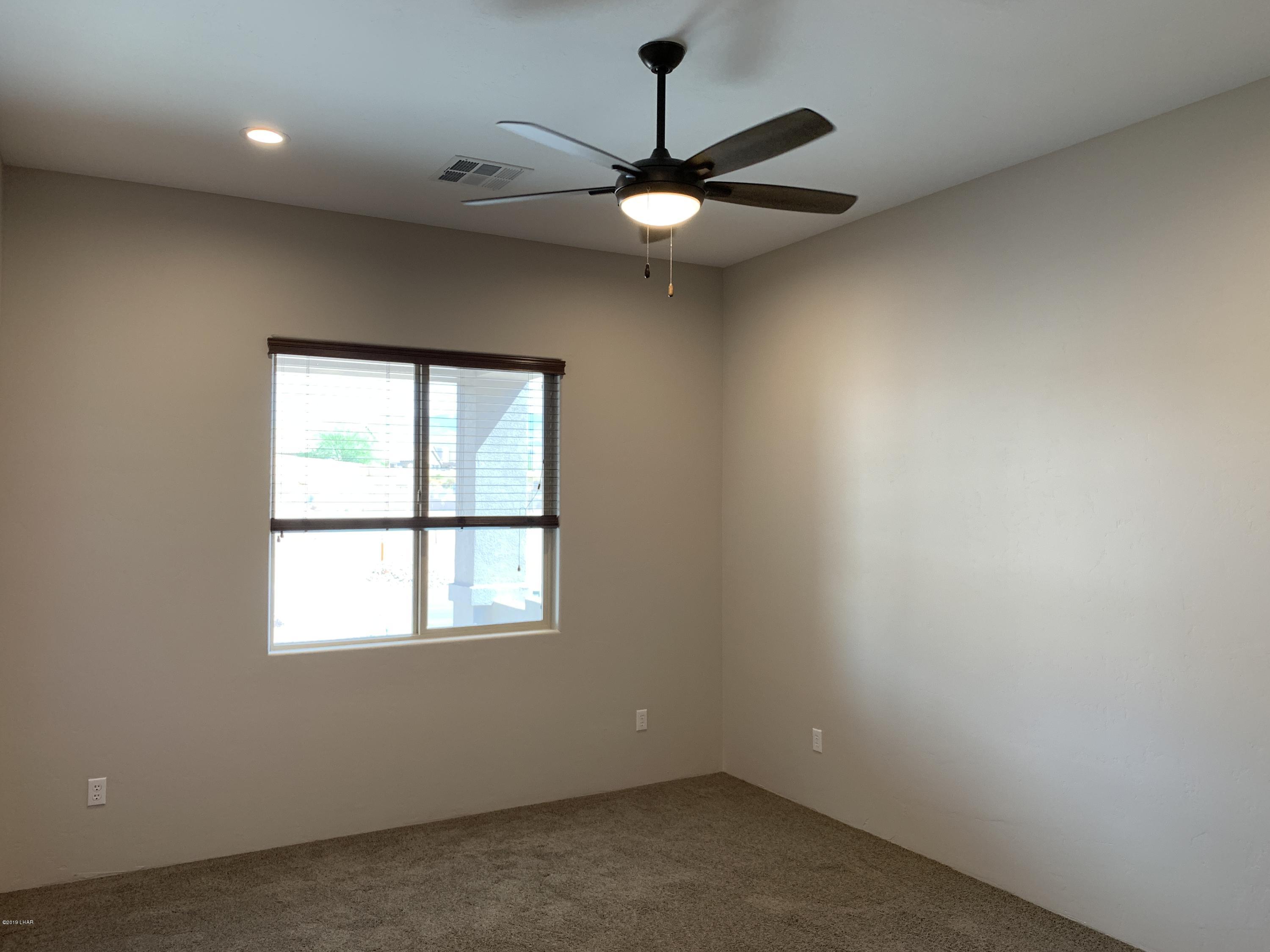 4731 North Juneberry Road Lake Havasu City, AZ 86404 - Photo 35 of 52 an empty room with a window