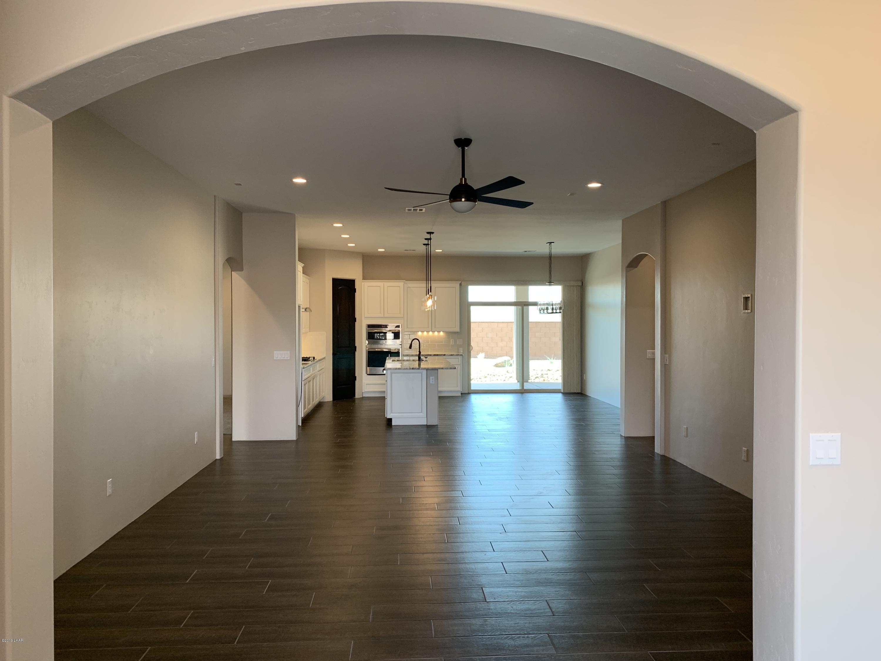 4731 North Juneberry Road Lake Havasu City, AZ 86404 - Photo 7 of 52 a view of a hallway with wooden floor