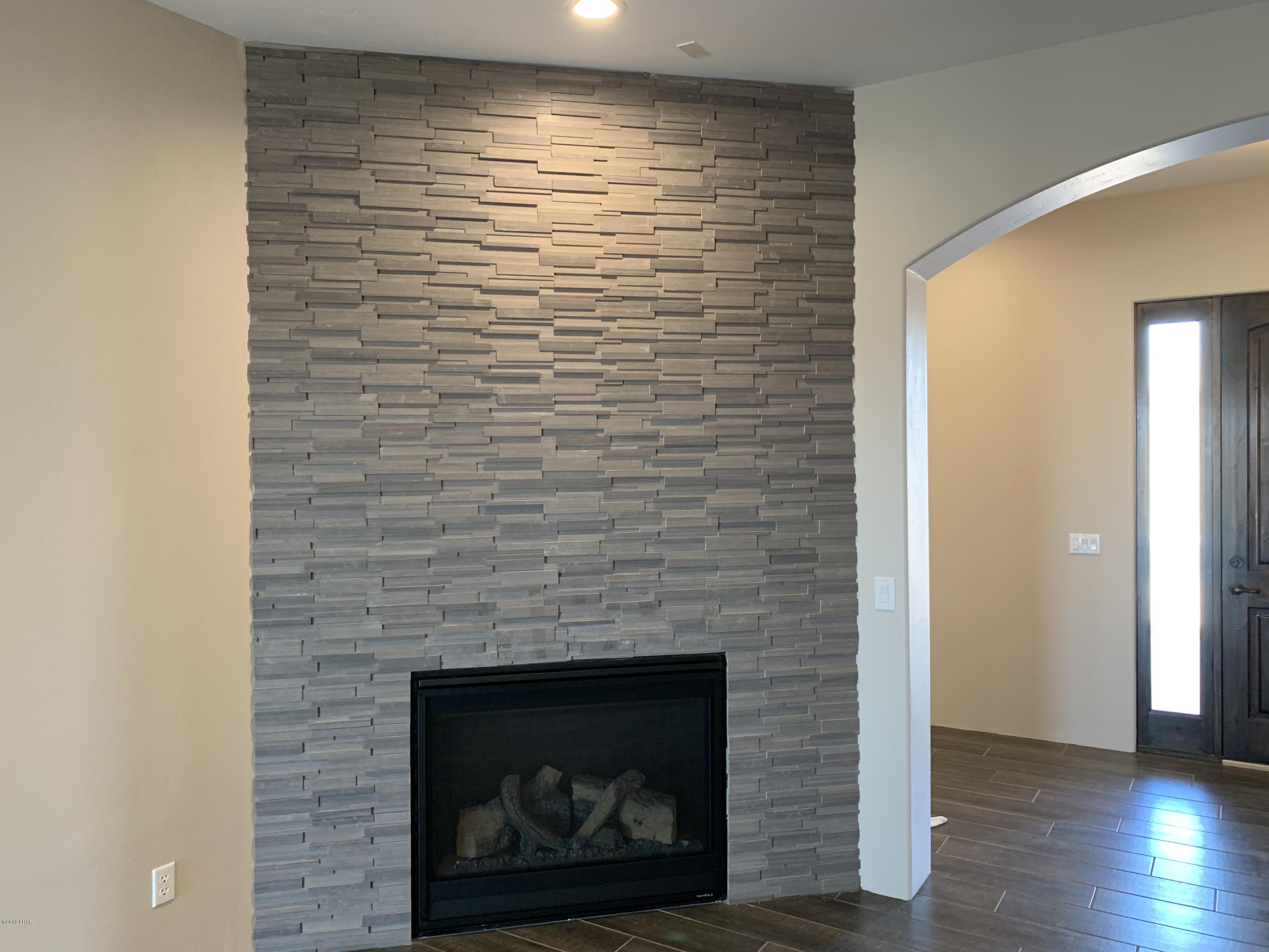 4731 North Juneberry Road Lake Havasu City, AZ 86404 - Photo 10 of 52 a room with a fireplace