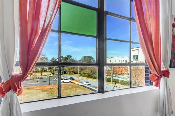 a view of a balcony with chairs