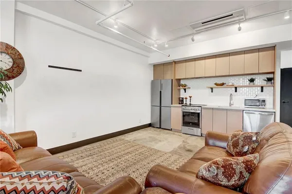 a living room with furniture and a rug