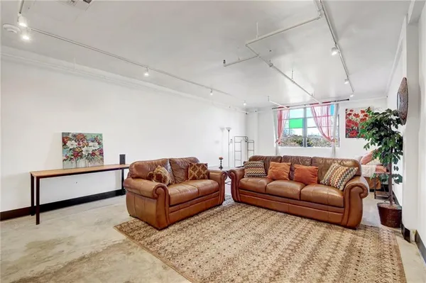 a living room with furniture window and a couch