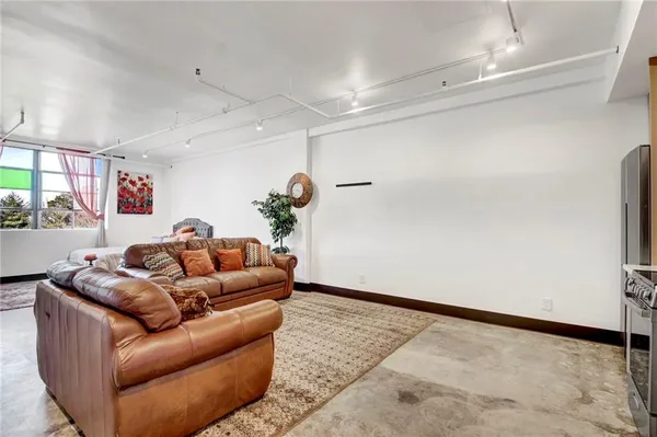 a living room with furniture and a rug