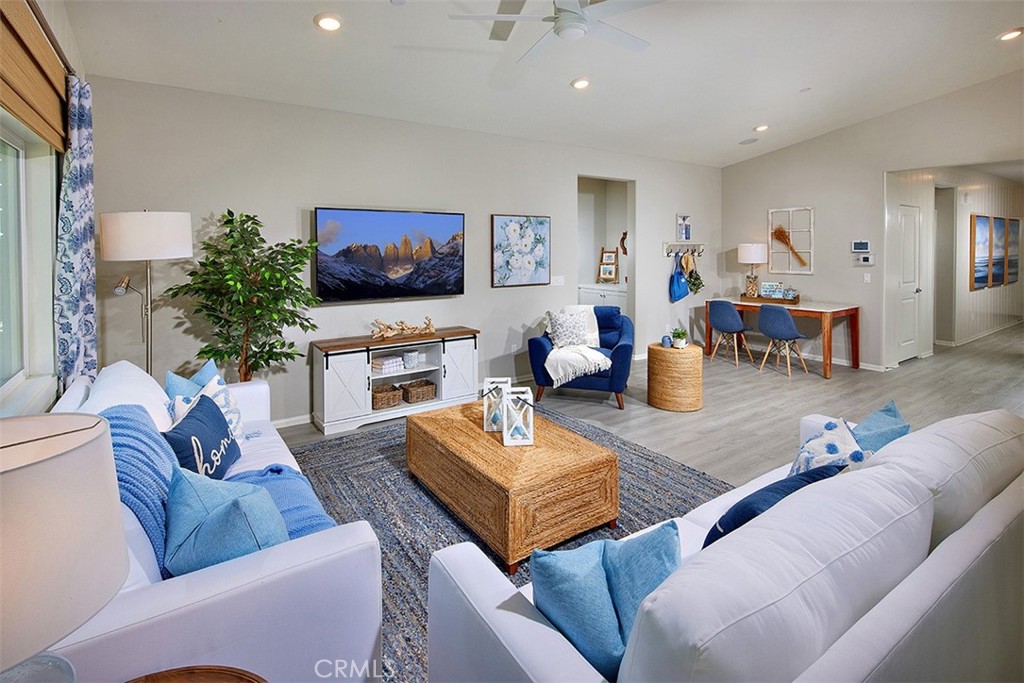 28484 Memory Lane Winchester, CA 92596 - Photo 2 of 12 a living room with furniture and a flat screen tv