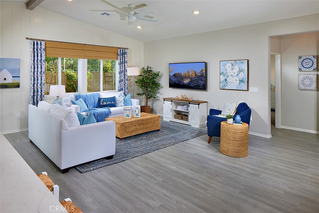 28484 Memory Lane Winchester, CA 92596 - Photo 3 of 12 a living room with furniture and a flat screen tv