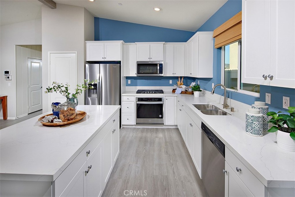 28484 Memory Lane Winchester, CA 92596 - Photo 6 of 12 a kitchen with furniture and a stove