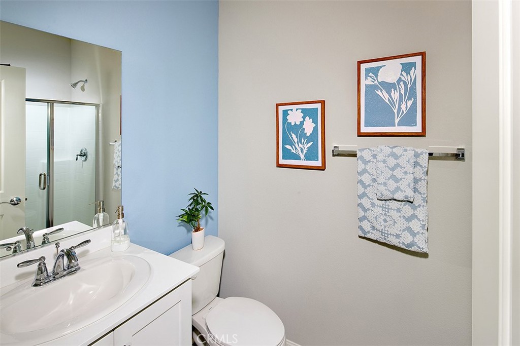 28484 Memory Lane Winchester, CA 92596 - Photo 8 of 12 a bathroom with a toilet sink and mirror