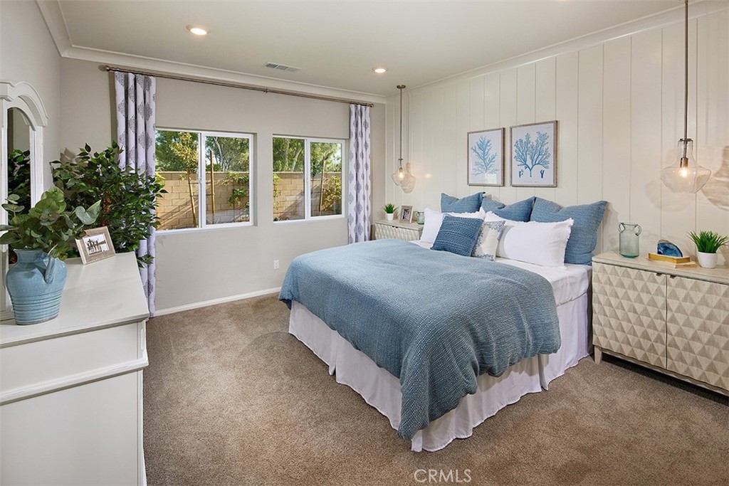 28484 Memory Lane Winchester, CA 92596 - Photo 9 of 12 a spacious bedroom with a bed and a window