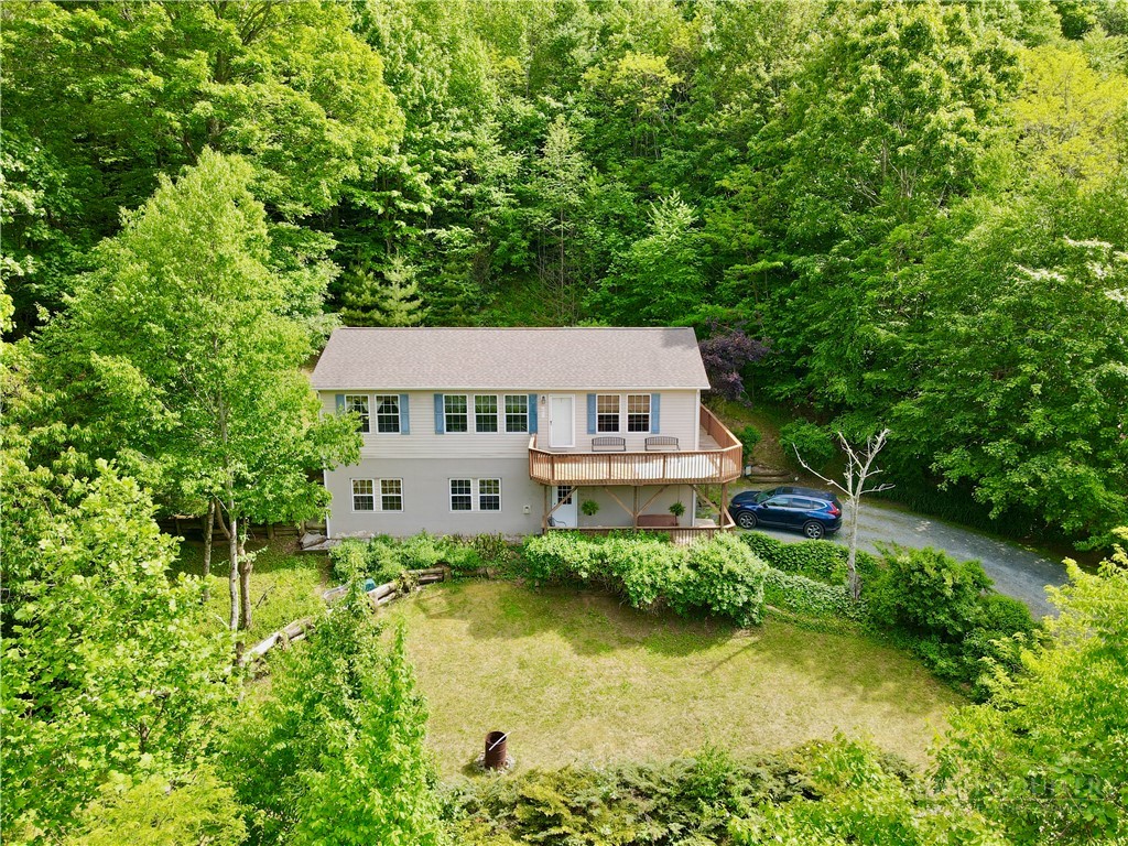 1173 Hopewell Church Road Boone, NC 28607 - Photo 35 of 39 an aerial view of a house with swimming pool next to a big yard