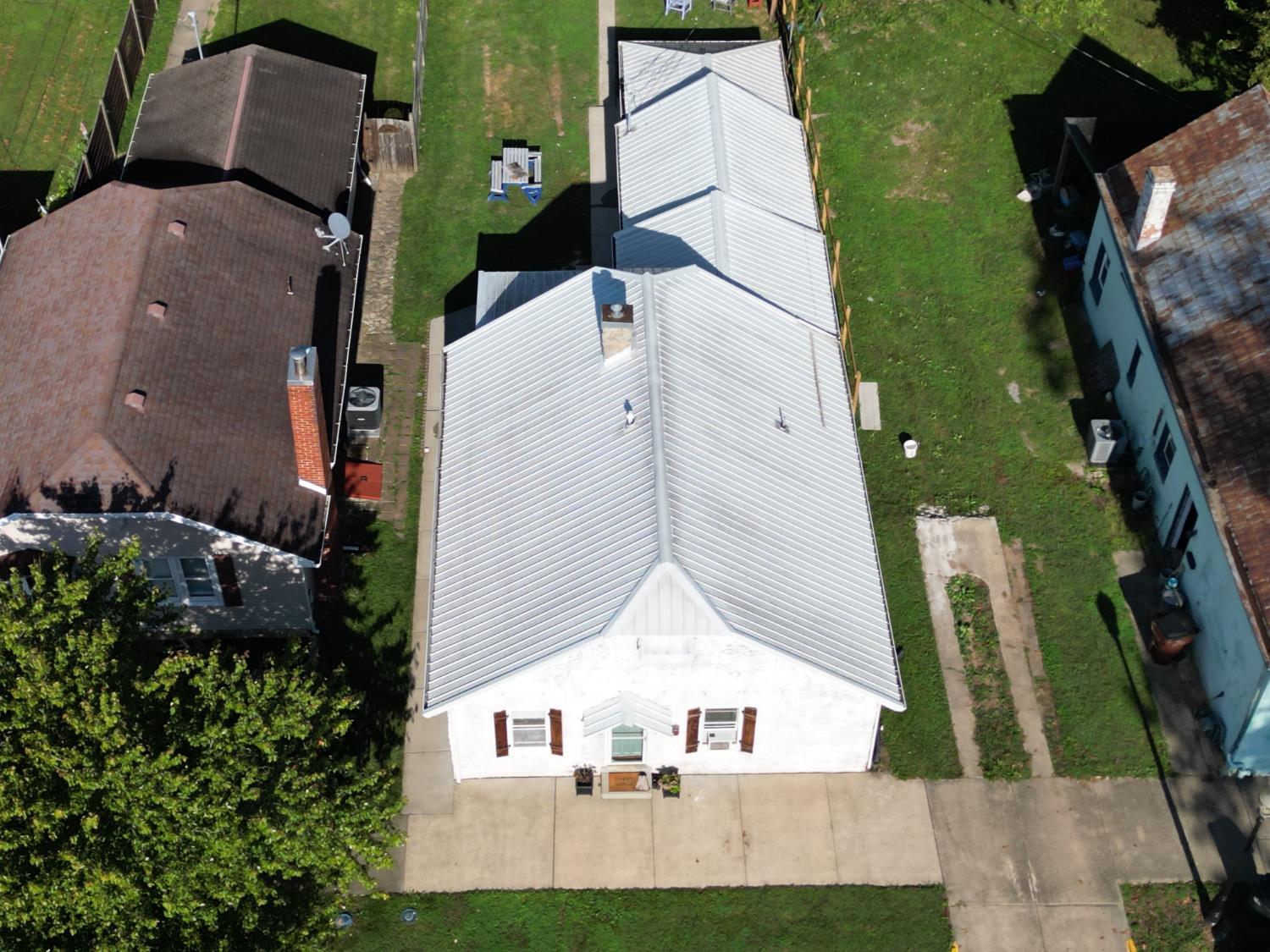 120 South Poplar Street Rising Sun, IN 47040 - Photo 22 of 43 This stunning aerial shot provides a new perspective, featuring the roofline and the entire property from a bird's-eye view.