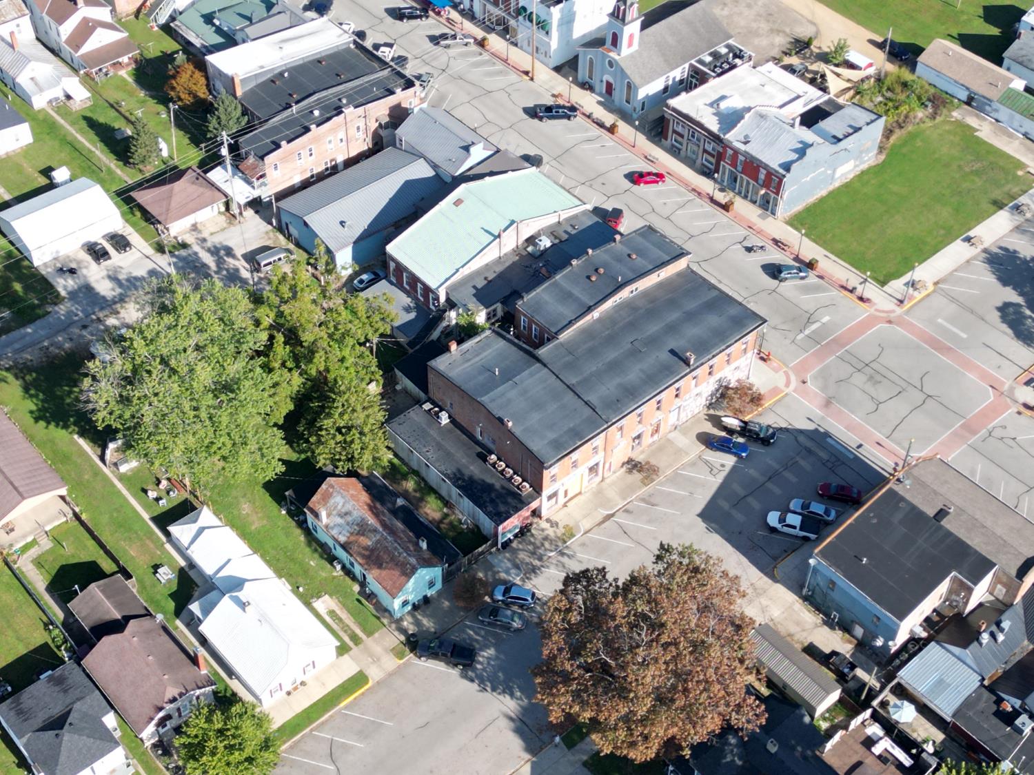 120 South Poplar Street Rising Sun, IN 47040 - Photo 24 of 43 Welcome home to this adorable stone cottage. This street view captures its charm and classic feel, ready to be enjoyed by its new owner.