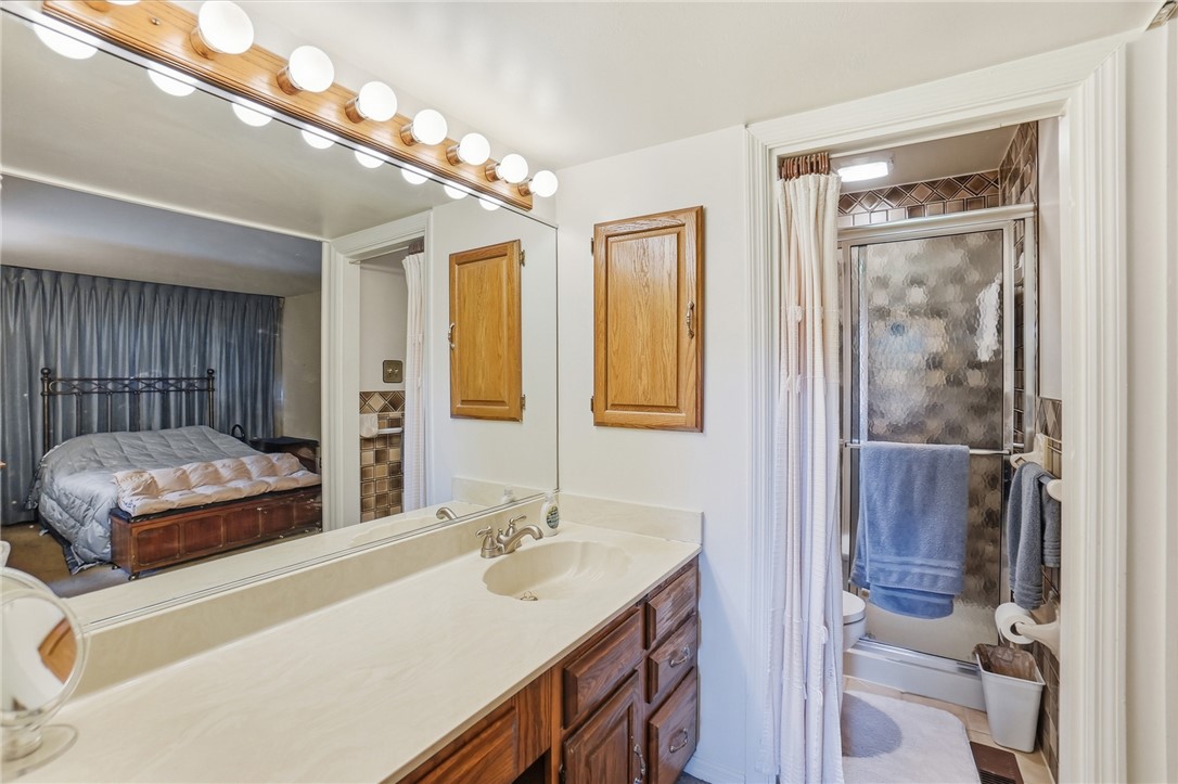 6225 Possum Run Road Bellbrook, OH 45305 - Photo 21 of 33 This functional bathroom features a shower and vanity with ample mirror space.