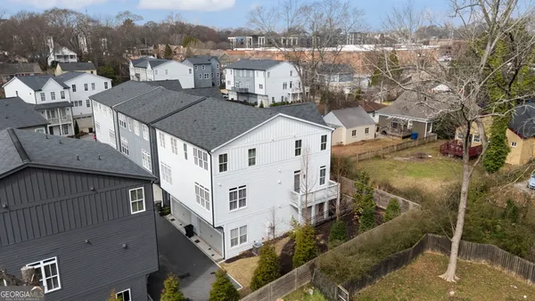 a aerial view of a house with a yard