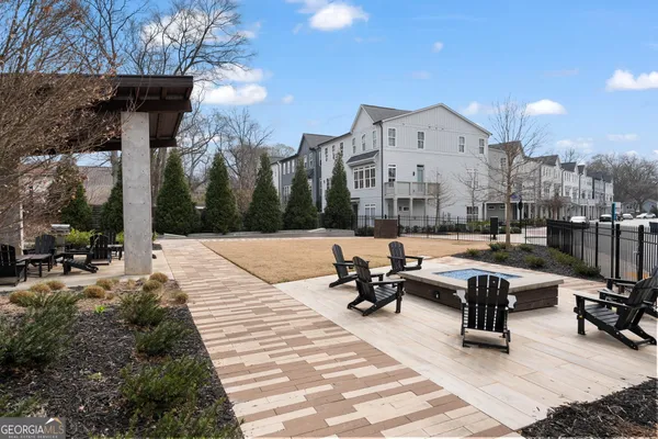 an aerial view of houses with outdoor space