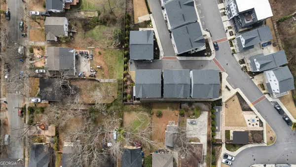 an aerial view of a residential apartment building with a yard