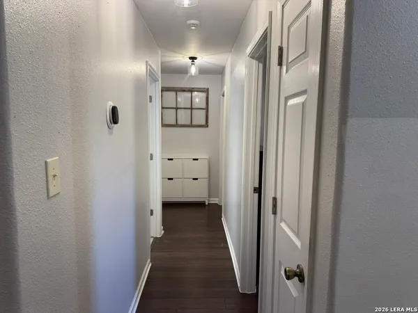 a view of a bathroom from the hallway