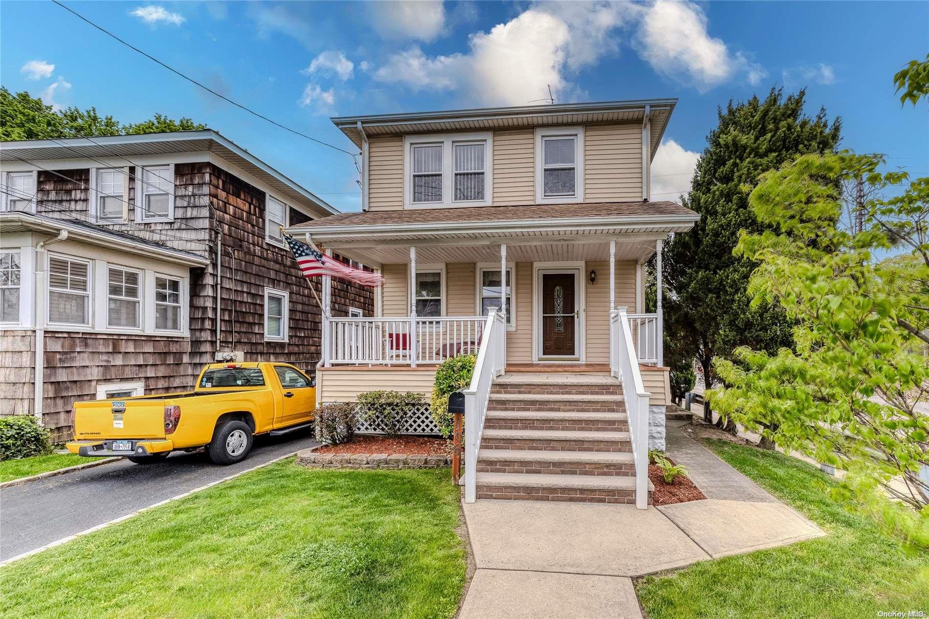 106 Lyon Place Lynbrook, NY 11563 - Photo 1 of 1 a house view with a garden space