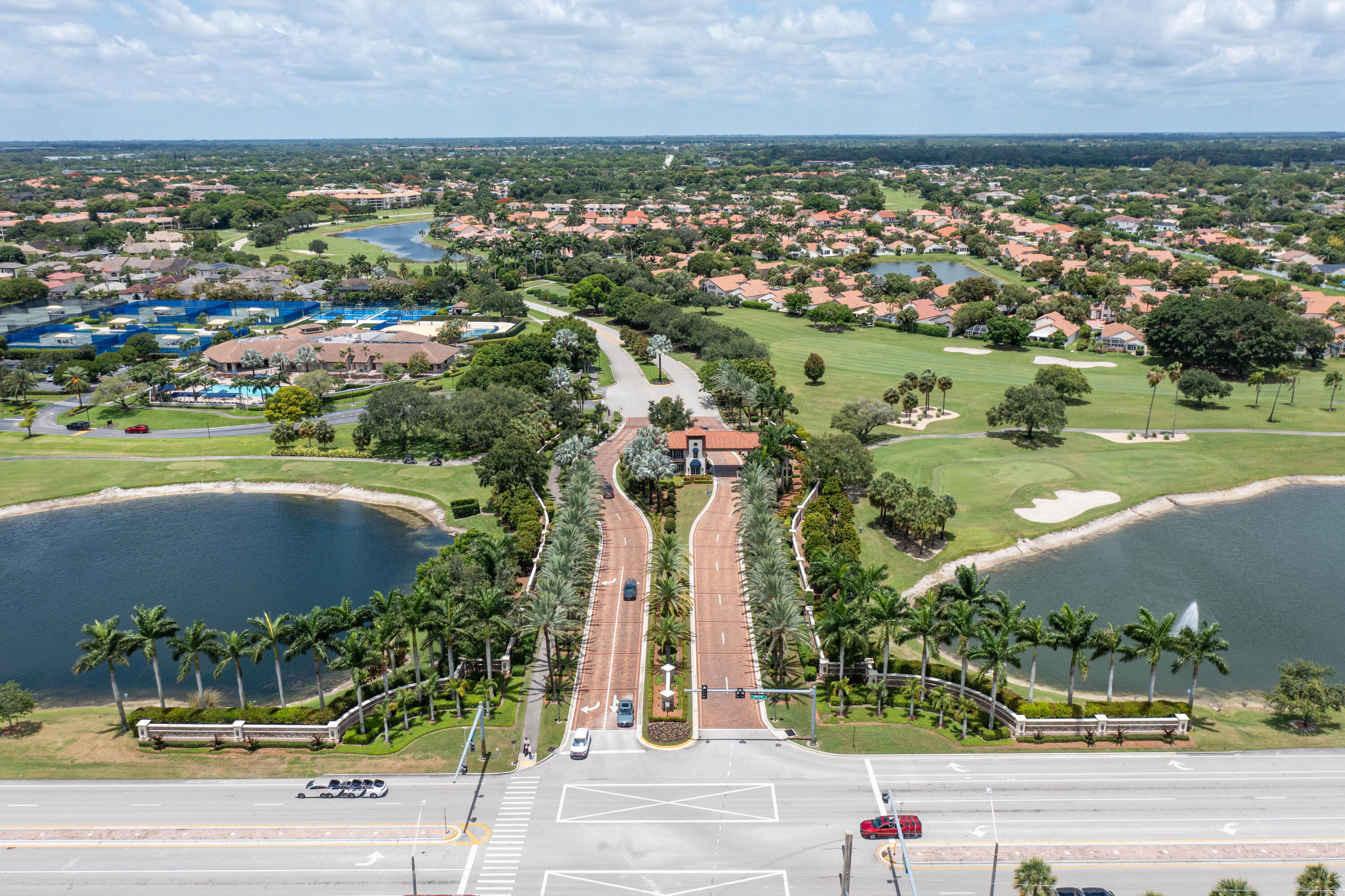 7520 La Paz Boulevard, Unit 104 Boca Raton, FL 33433 - Photo 49 of 56 an aerial view of residential building and lake